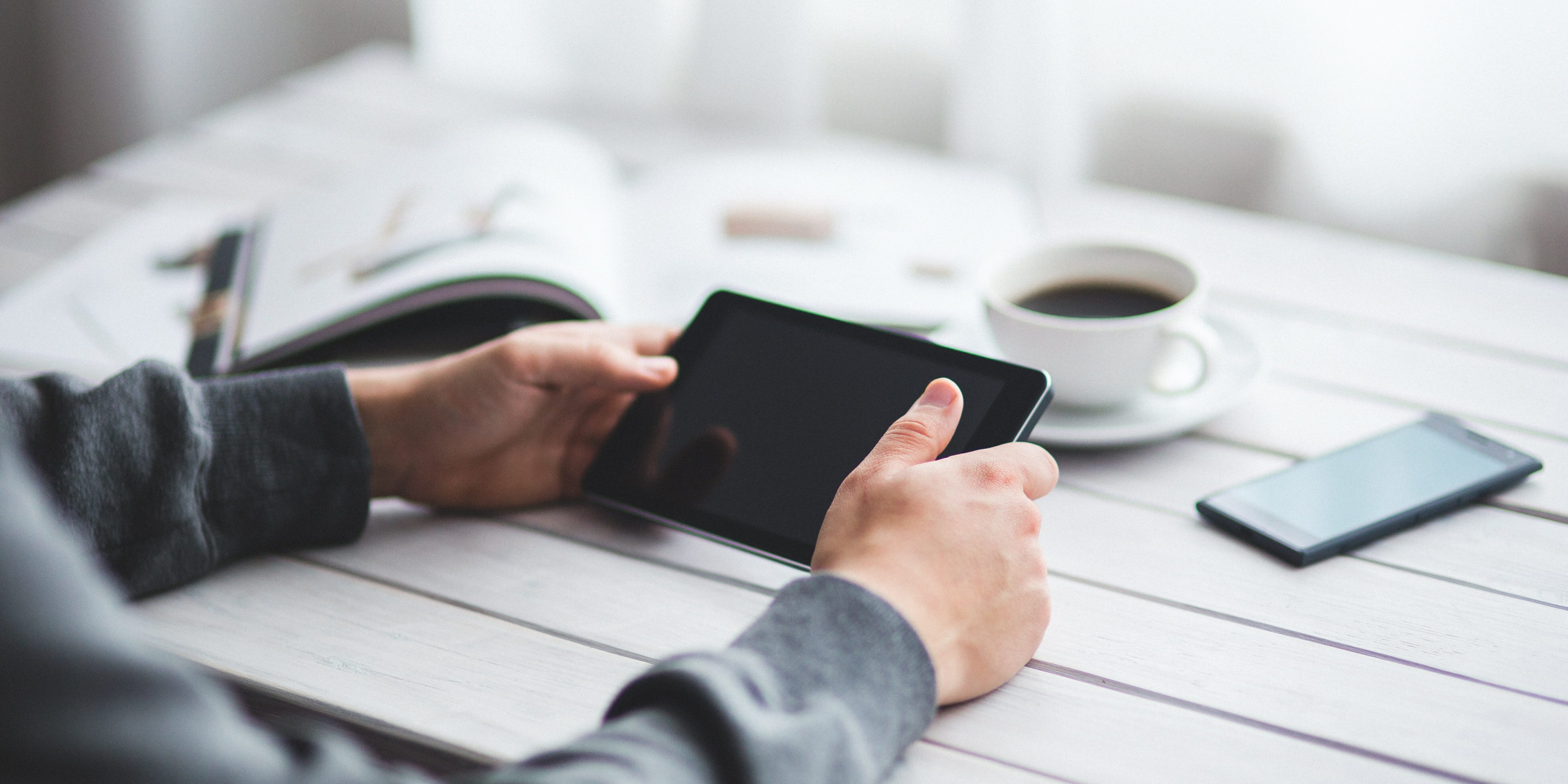 man-holds-digital-tablet-in-his-hands-6363