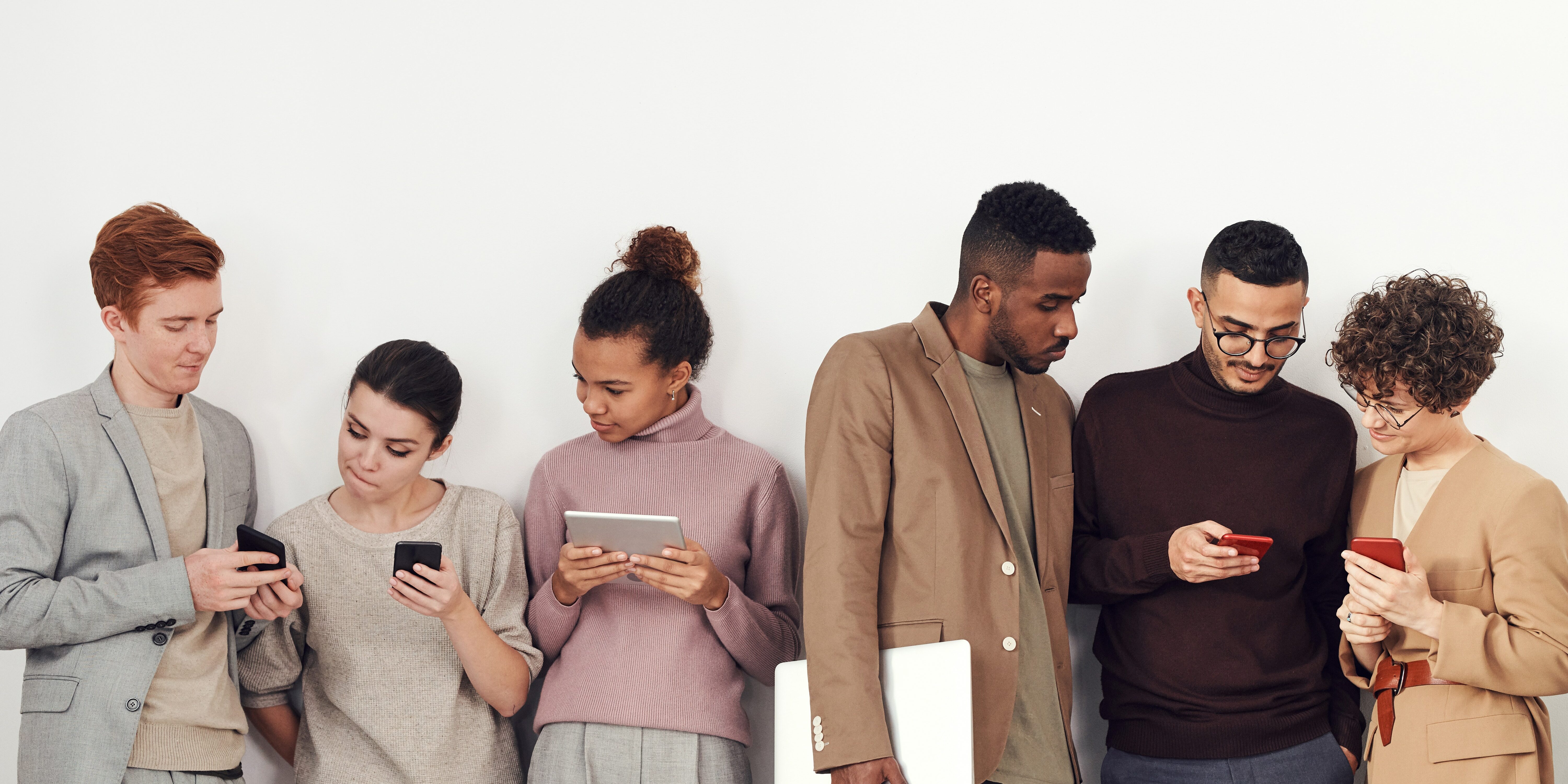 photo-of-people-standing-near-white-wall-3183180