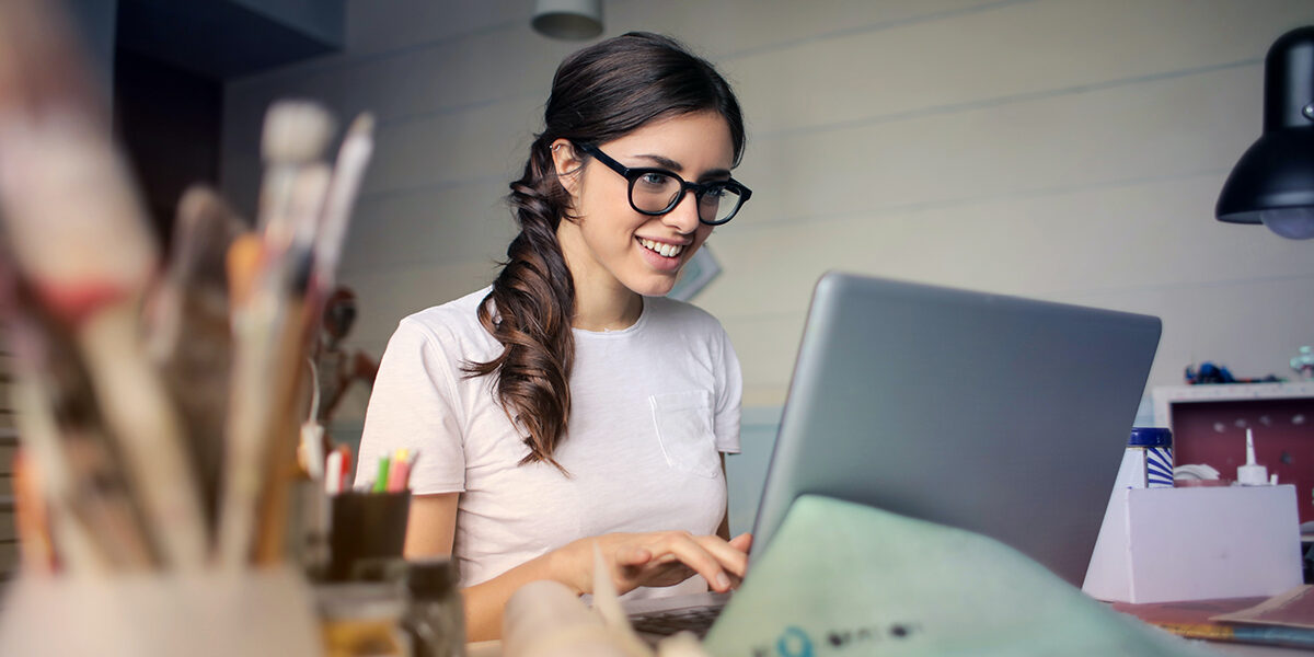 photo-of-woman-using-her-laptop-935756